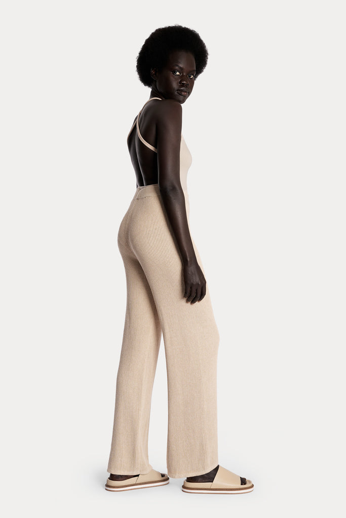 All natural zero waste knitted cotton pants in sand with eco rib knit bodysuit in sand colour right side full body view.