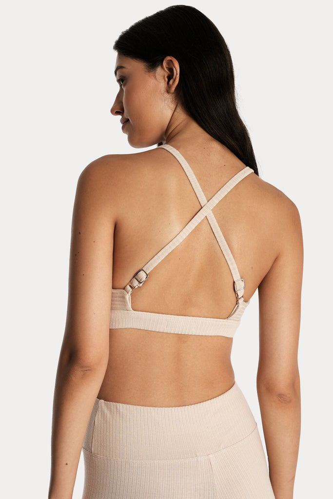 ECO RIB BRALETTE | SAND with ECO RIB STIRRUP LEGGINGS | SAND; back side closeup view.