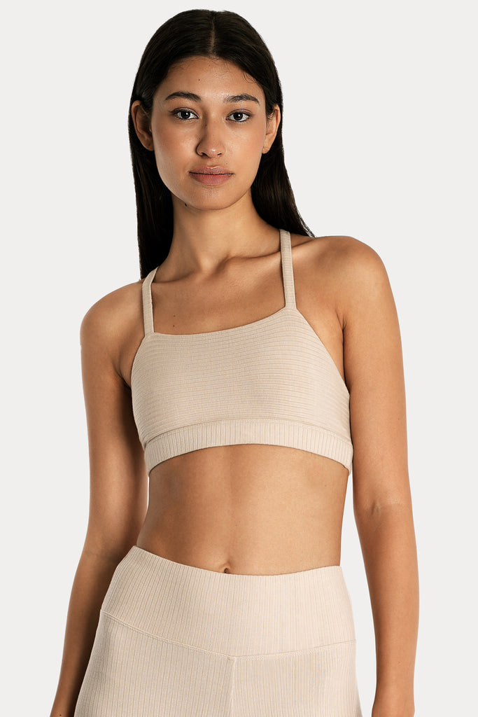 ECO RIB BRALETTE | SAND with ECO RIB STIRRUP LEGGINGS | SAND; front side closeup view.