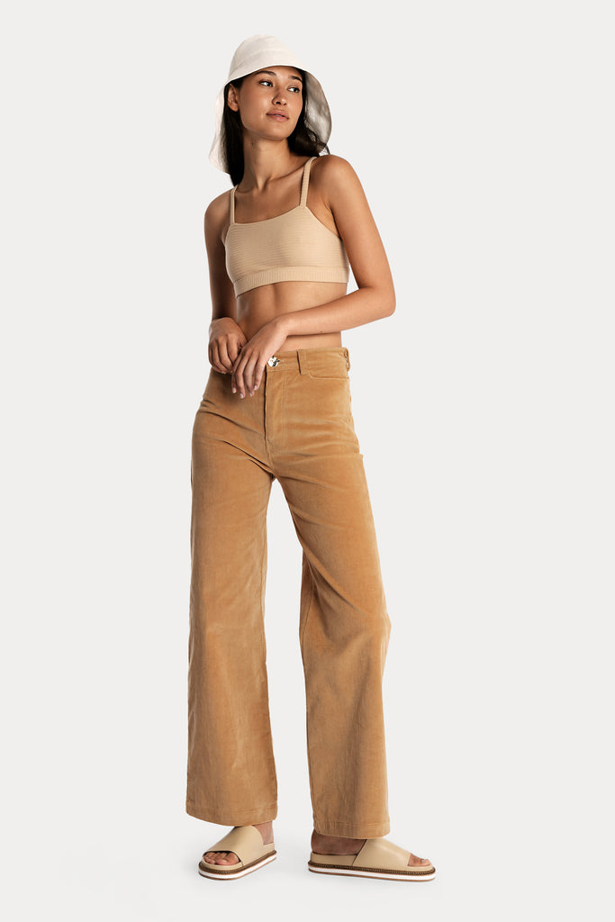 LENZING™ ECOVERO™ ECO RIB BRALETTE  | TAN with CORDUROY TROUSERS | DOE with LINEN WIDE BRIM HAT | WHITE; front side full body view.