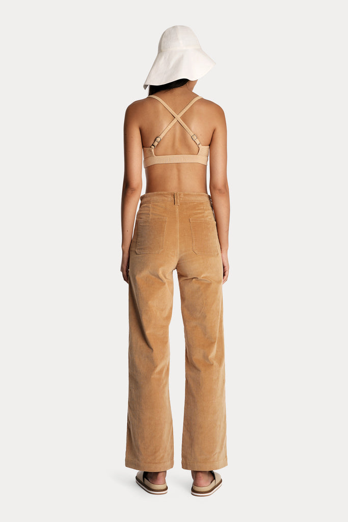 LENZING™ ECOVERO™ ECO RIB BRALETTE  | TAN with CORDUROY TROUSERS | DOE with LINEN WIDE BRIM HAT | WHITE; back side full body view.