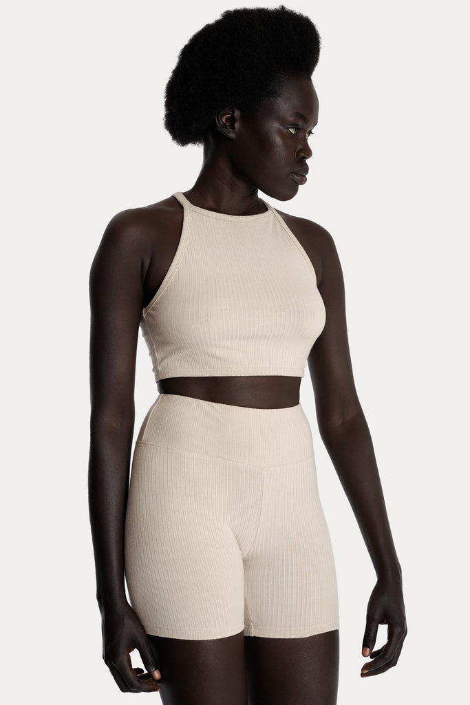 ECO RIB CROP TOP | SAND with ECO RIB BIKER SHORTS | SAND; front right side closeup view.