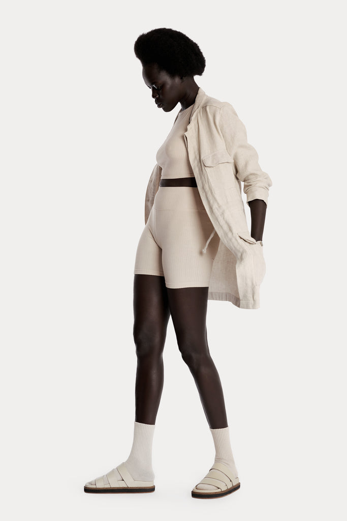 ECO RIB CROP TOP | SAND with ECO RIB BIKER SHORTS | SAND and LINEN JACKET  | SAND; left side full body view.