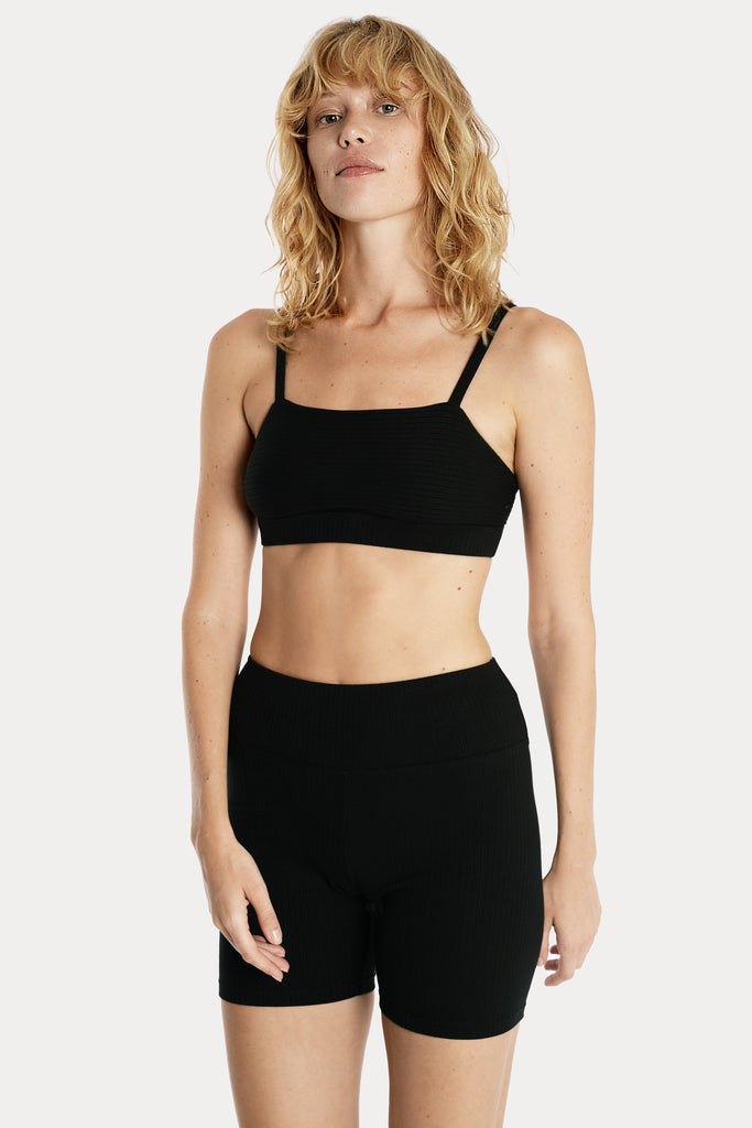 Lenzing ecovero eco rib jersey knit bralette in black with knit biker shorts in black front side closeup view.