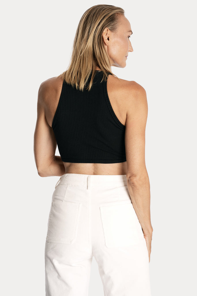 Lenzing ecovero eco rib jersey knit crop top in black with wide leg trousers in white colour back side closeup view.