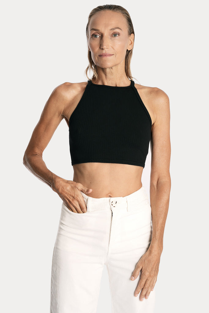 Lenzing ecovero eco rib jersey knit crop top in black with wide leg trousers in white colour front side closeup view.