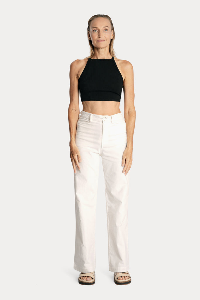 Lenzing ecovero eco rib jersey knit crop top in black with wide leg trousers in white colour front side full body view.