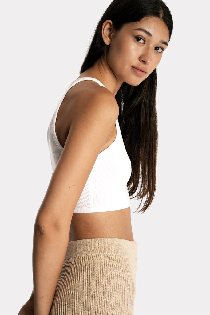 Lenzing ecovero eco rib jersey knit crop top in white with knit biker shorts in tan colour right side closeup view.
