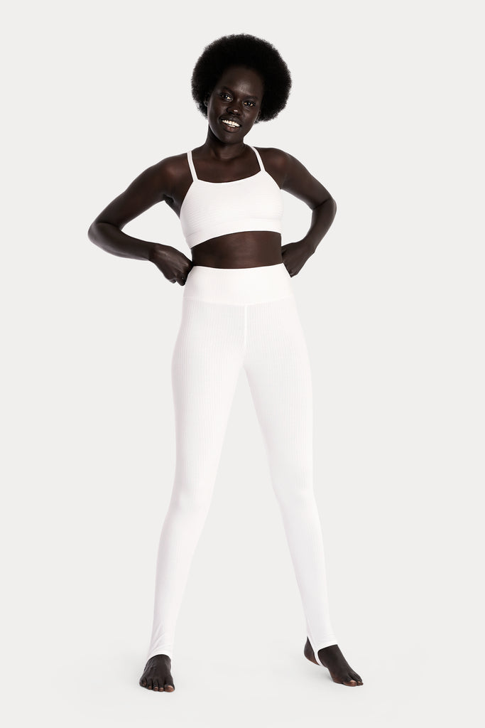 Lenzing ecovero eco rib jersey knit stirrup leggings in tan with knit crop top in white front side full body view.
