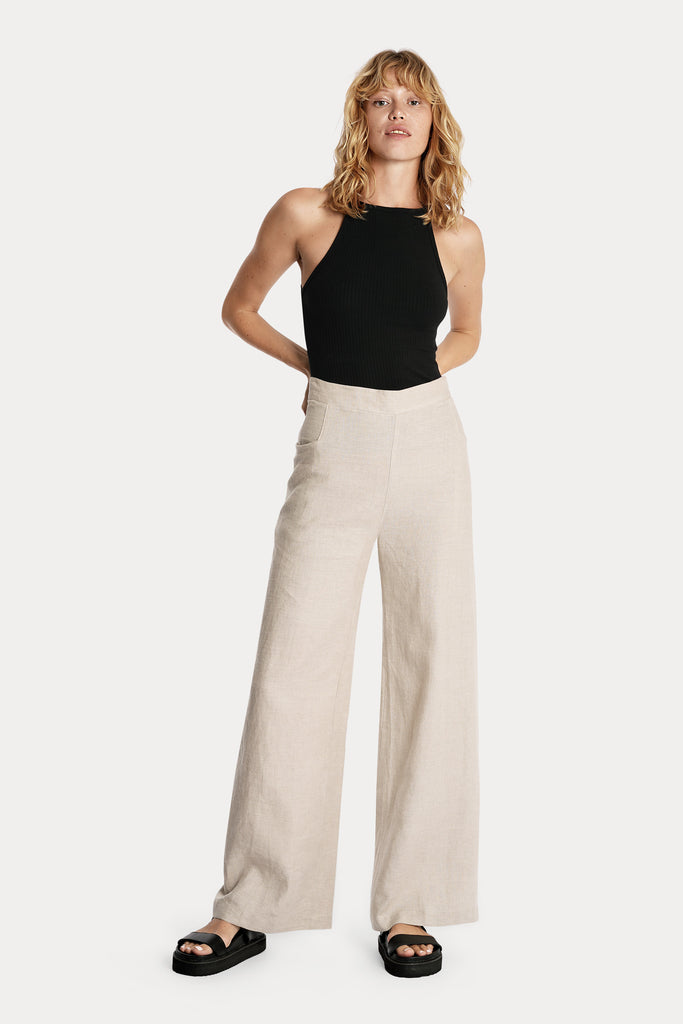 Lenzing ecovero eco rib jersey knit tanktop in black with linen wide leg trousers in sand front side full body view.