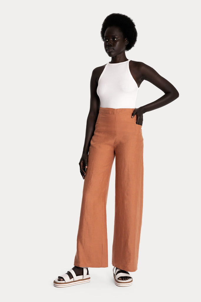Lenzing ecovero eco rib jersey knit tanktop in black with linen wide leg trousers in clay front side full body view.