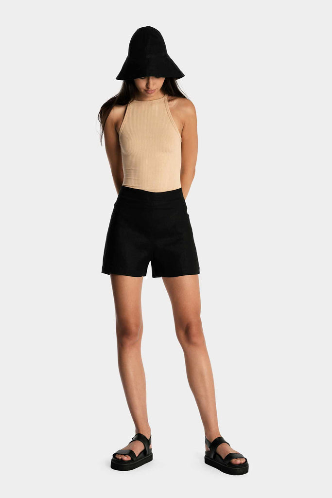 ECO RIB TANK TOP | TAN with ECO RIB BIKER SHORTS | BLACK with LINEN WIDE BRIM HAT | BLACK; front side full body view.